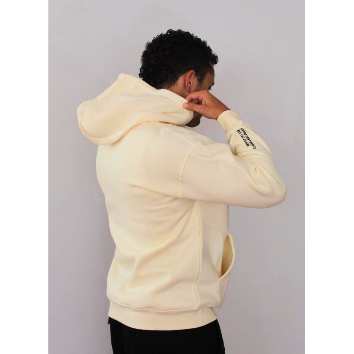 Back view of man wearing Legacy29 Cloud 9 cream hoodie. Soft oversized fit with a cosy hood, perfect for resilience and everyday comfort.