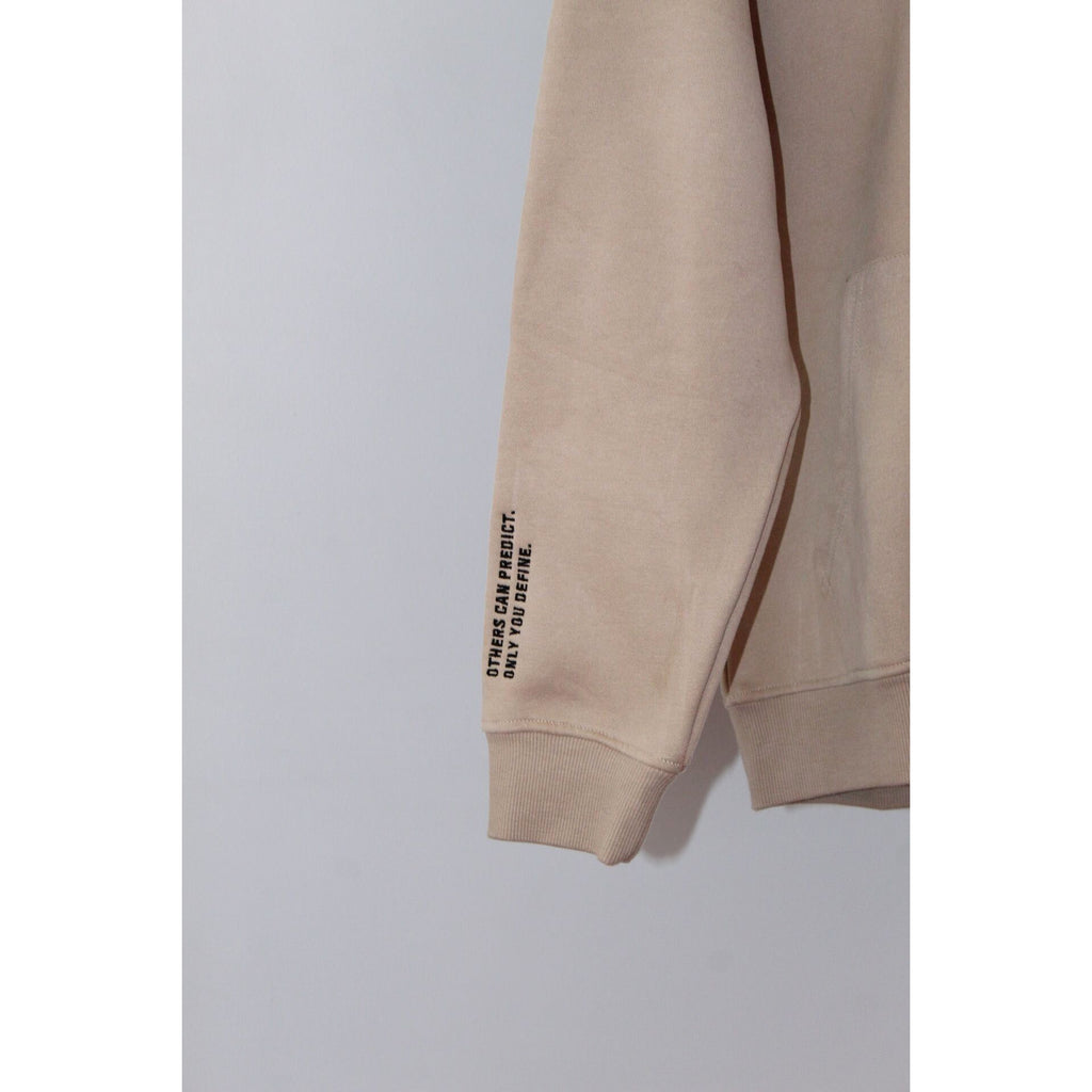Close-up of the sleeve detail on the Legacy29 Desert Dawn Beige hoodie, featuring an inspiring printed message on the cuff.