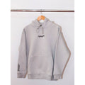 Legacy29 Resilience Collection: Silver Linings Grey Comfort Hoodie hanging on a wooden hanger. Soft fabric with embroidered logo on chest.