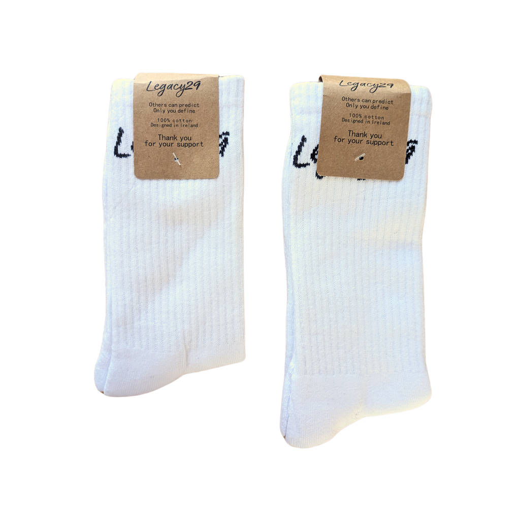 Pair of Legacy29 Resilience Collection white cotton socks with packaging. Soft, breathable fabric with a unisex design for all-day comfort.