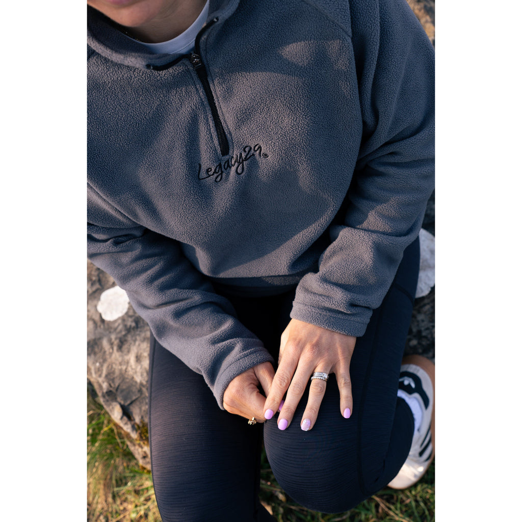 Close-up of Legacy29 Onyx Blue Fearless Fleece, showcasing premium fleece texture and embroidered branding. A stylish and supportive mental health apparel piece.