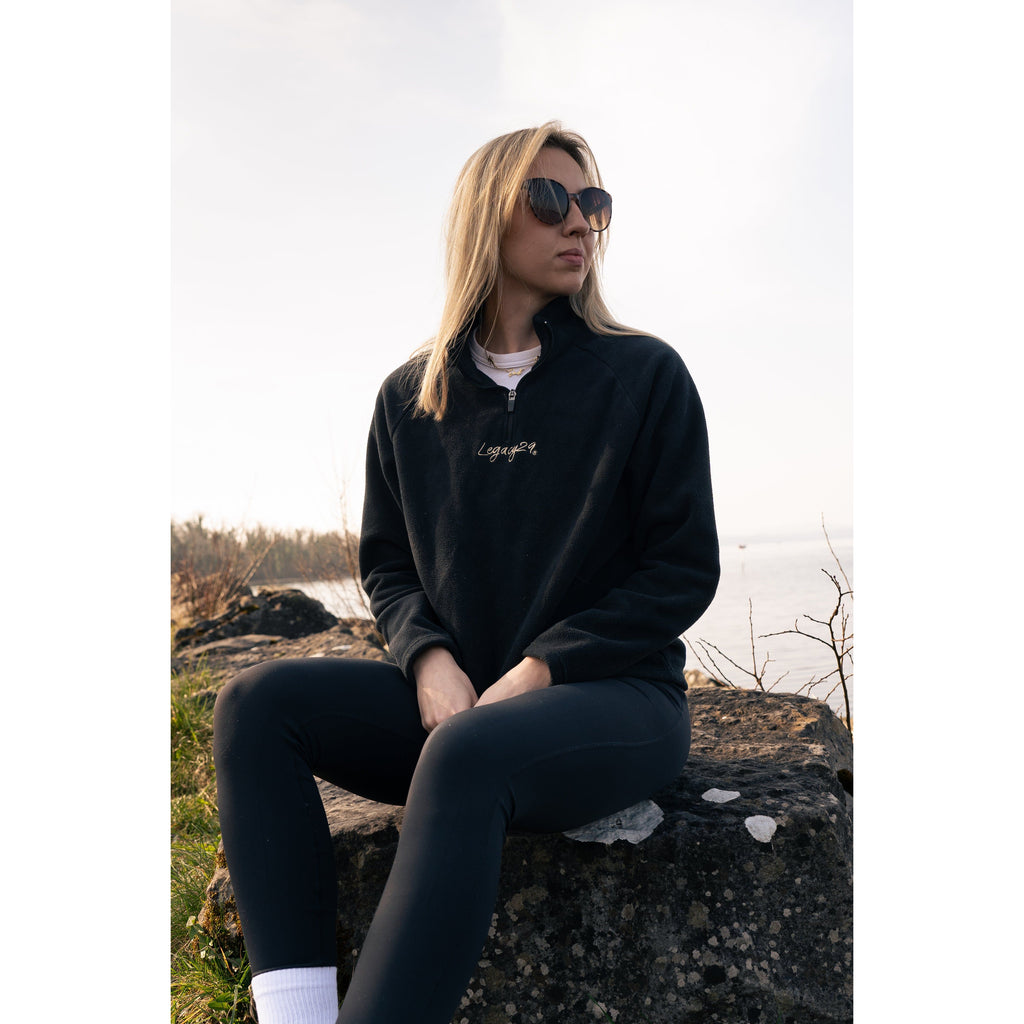 Obsidian Black Fearless Fleece by Legacy29, a premium mental health support apparel featuring an embroidered logo, worn outdoors for a stylish and cozy look.