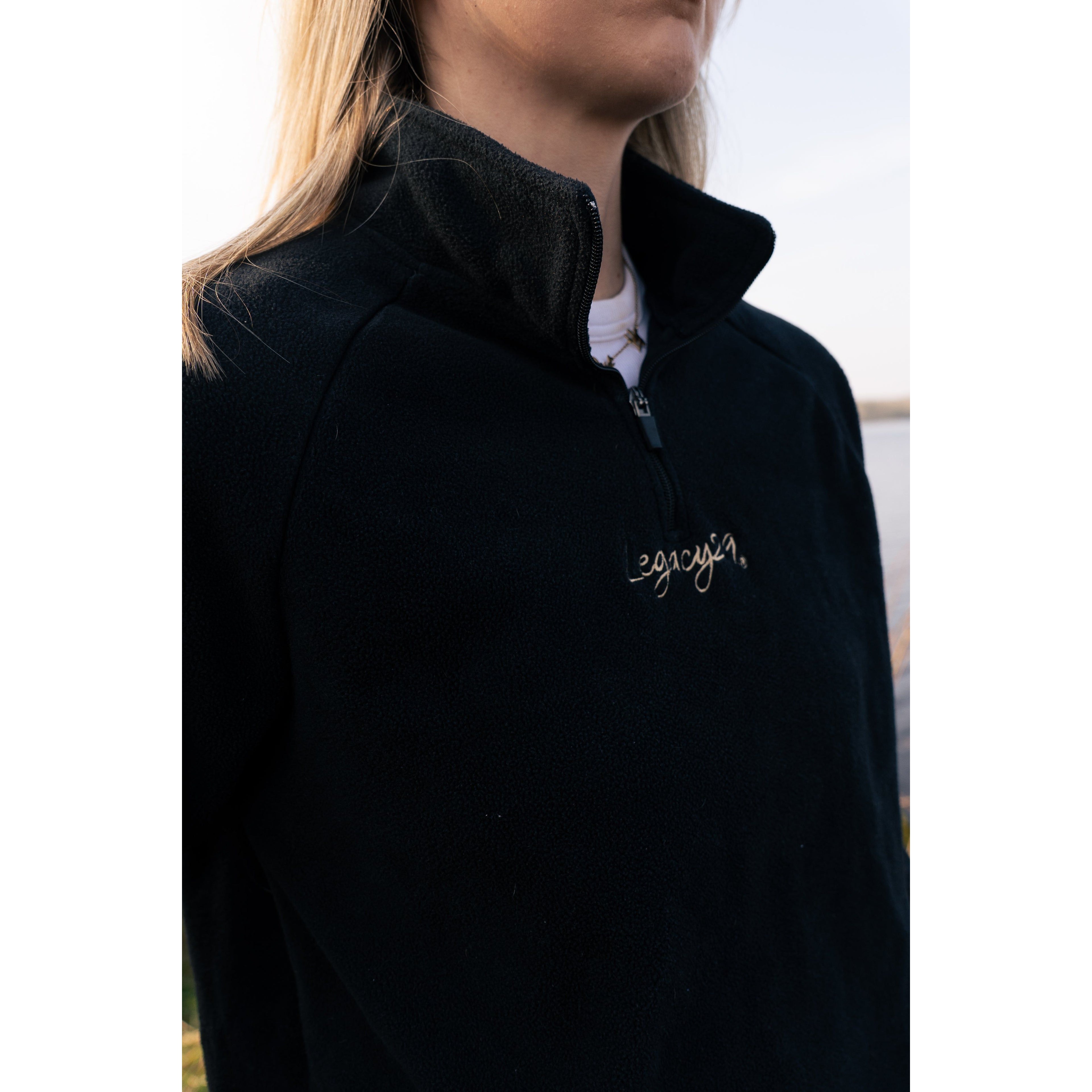 Close-up of the Legacy29 Obsidian Black Fearless Fleece, showcasing the embroidered branding and high-quality fleece fabric for warmth and comfort.