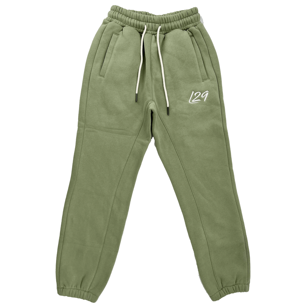 Legacy29 junior khaki green tracksuit bottoms with elastic waistband and embroidered logo. Comfortable and stylish for active kids.