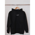 Legacy29 Bold Beginnings Black Hoodie hanging on a wooden hanger. Premium comfort hoodie with embroidered logo, designed for resilience and warmth.