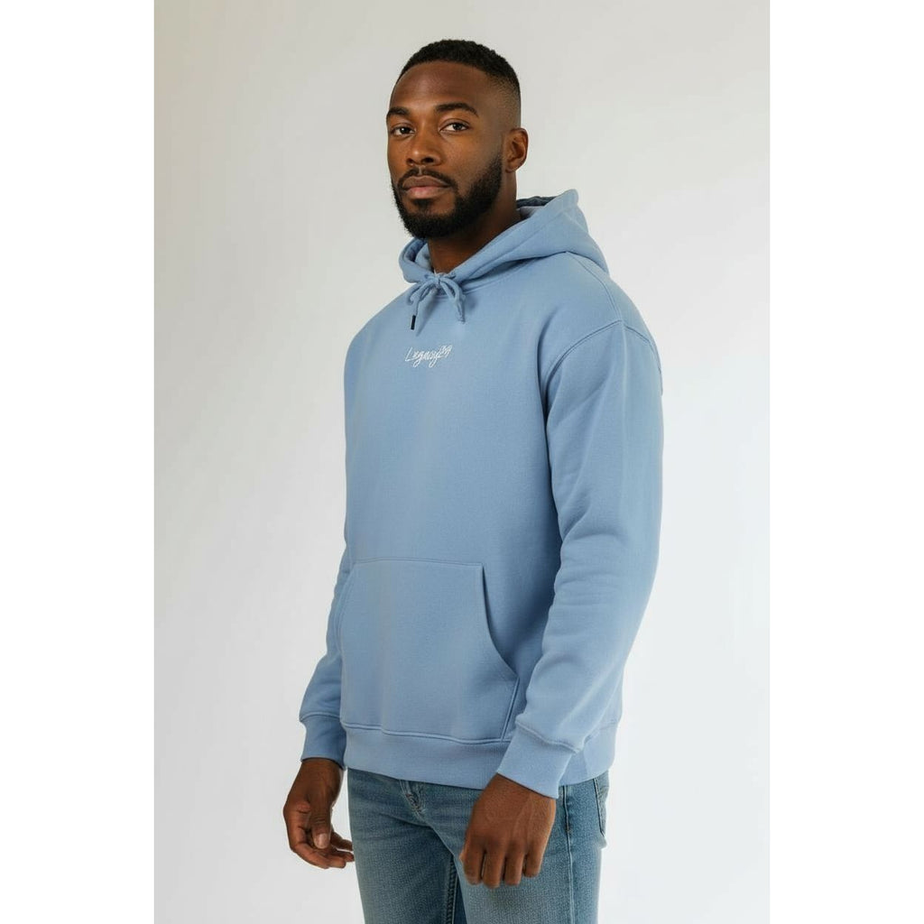 Man wearing a light blue hoodie with a brand logo on a white background
