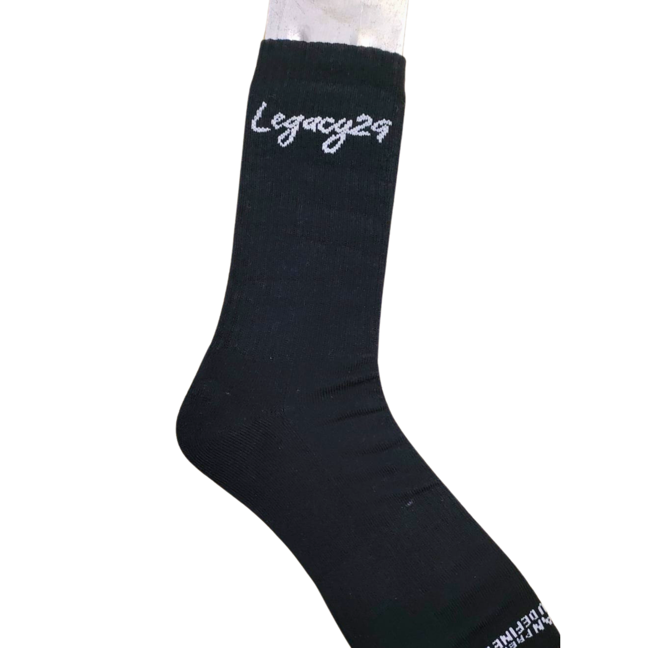 Legacy29 Resilience Collection black sock with white logo detail, showcasing stretch fit and premium cotton material for comfort and durability.