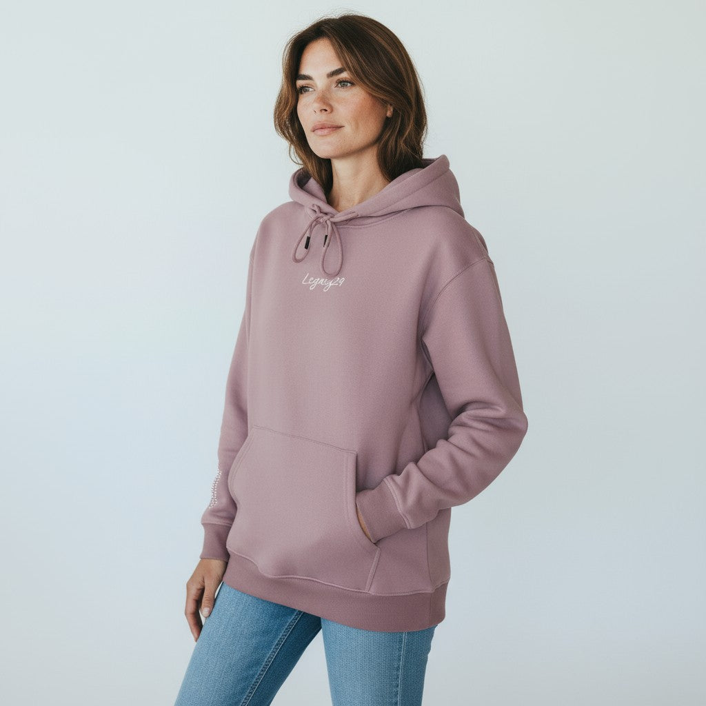 Woman wearing a lavhoodie with a logo on a light gray background