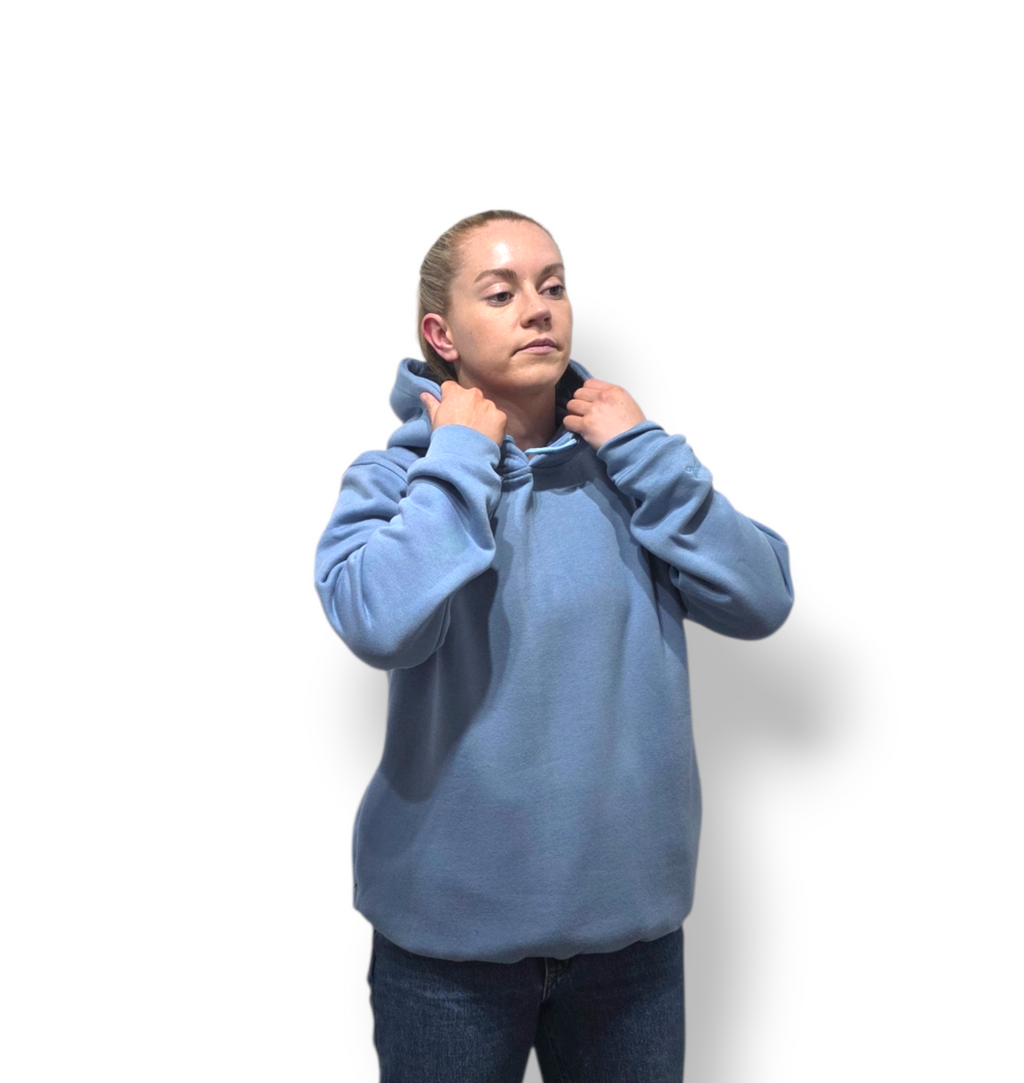 Person wearing a blue hoodie against a white background