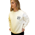 Model wears Legacy29 Cream Jumper in size extra small